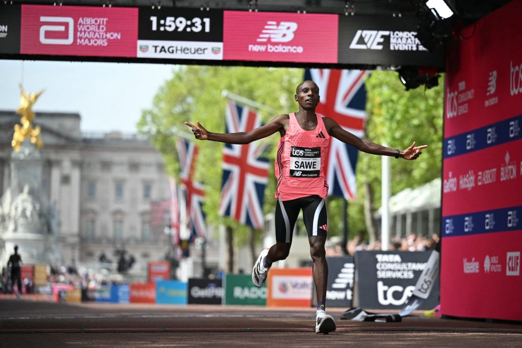 Kenya's Sabastian Sawe crosses the line to win the men's race in a new world record time at the 2026 London Marathon.