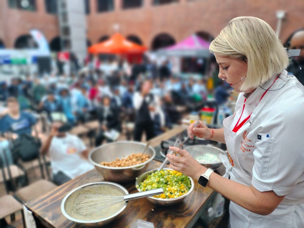 Chef Danielle Venter of Unilever Food Solutions, one of the exhibitors at this expo for 2026 preparing a dish.