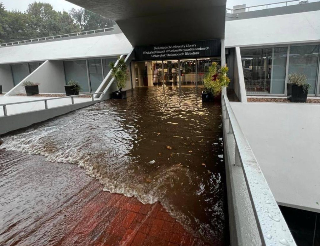 A photo of water flooding the entrance at Stellenbosch University Library. Photo: Facebook