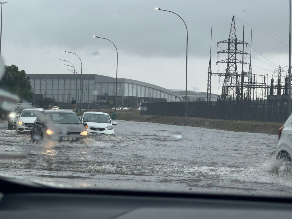 Cars "swimming" through the flooded intersection of Bottelary and Cecil Morgan roads in Brackenfell. Photo: Facebook