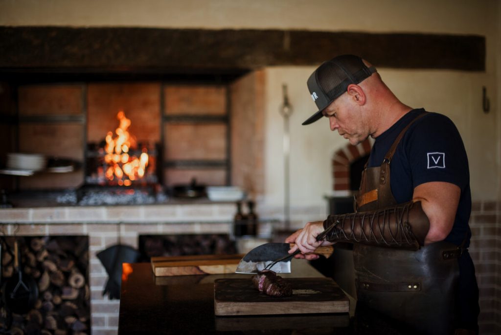 Scrooby hard at work in the kitchen at VUUR. The eatery's recent recognition positions it alongside established international steakhouses. Photo: Claire Gunn