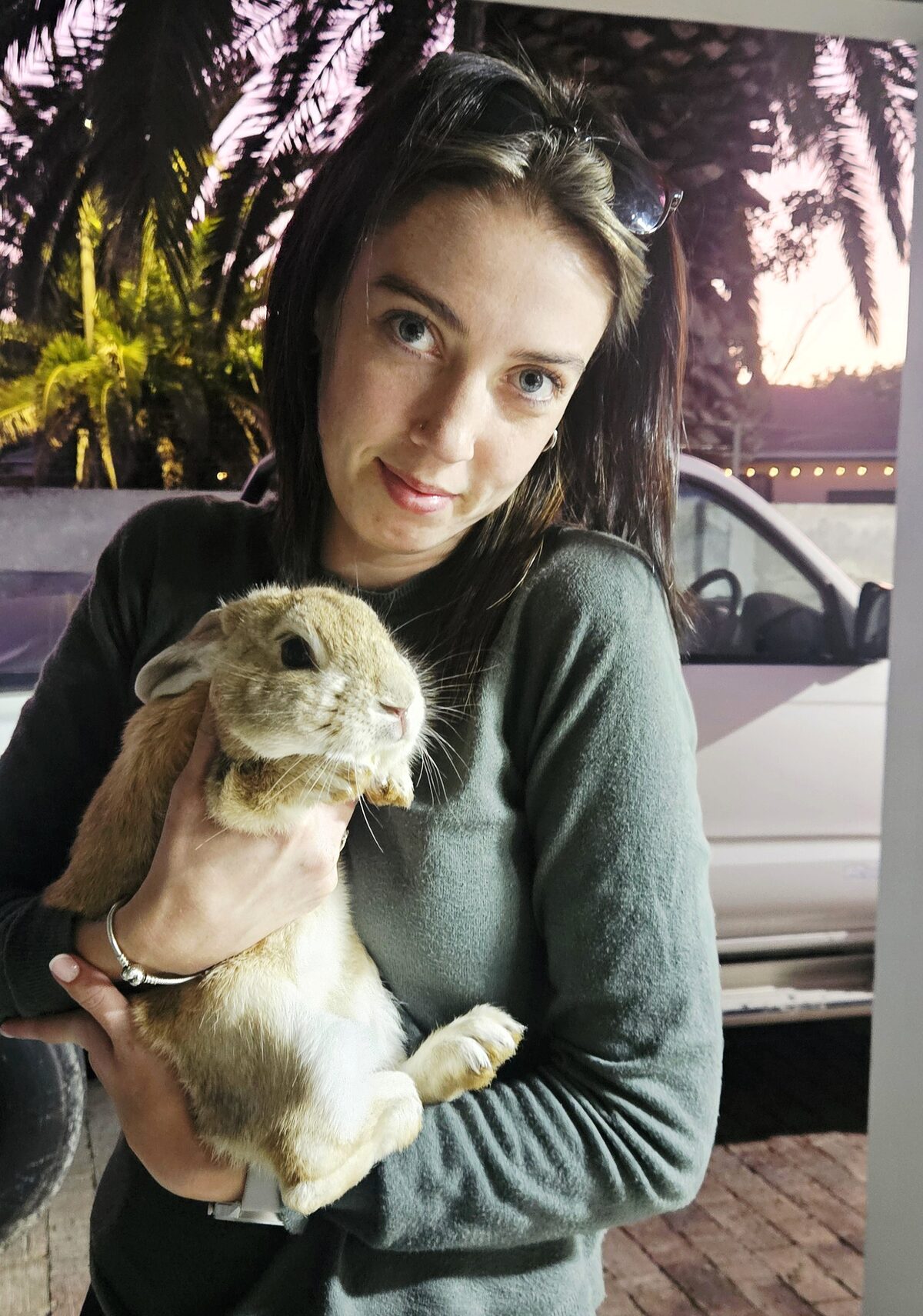 Kaylin-Lee Eveleigh is holding Chase, whose leg and pelvis were broken. Chase had to be euthanised.