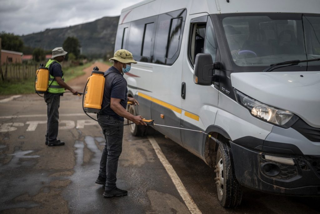 Health officials spray a van against the risk of foot-and-mouth disease contamination outside an area where cattle are affected by the disease in Humansdorp. Photo: Marco Longari, AFP