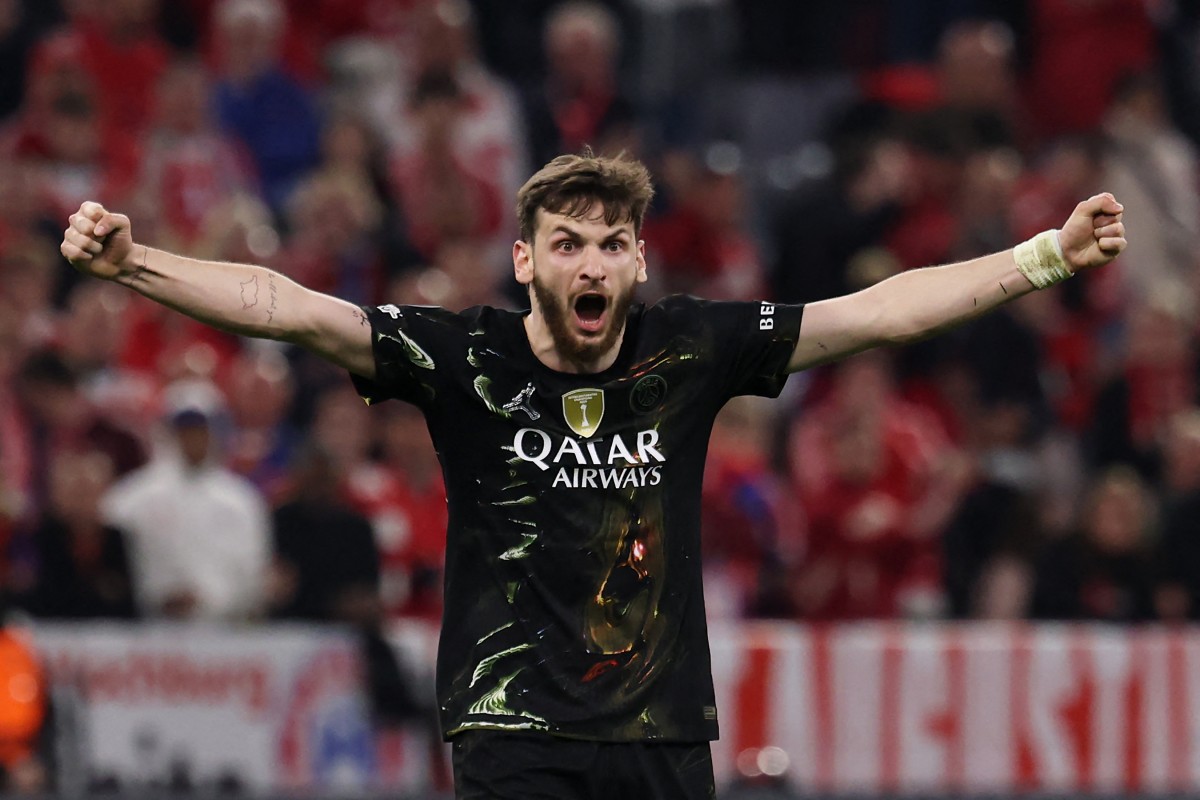 Paris Saint-Germain's Georgian forward #07 Khvicha Kvaratskhelia celebrates at the end of the UEFA Champions League second-leg, semi-final football match between FC Bayern Munich and Paris Saint-Germain (PSG)