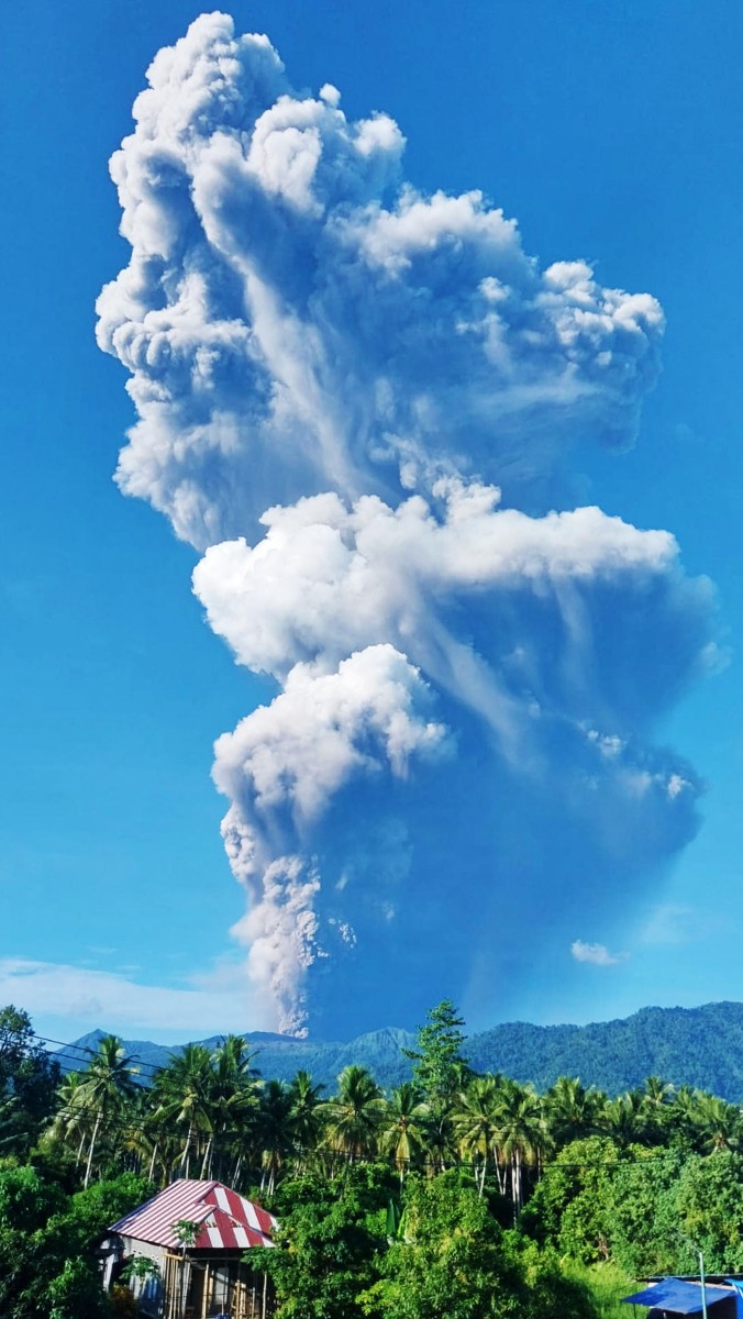 A handout picture taken and released by Indonesia’s Geological Agency, shows smoke rising from the eruption of Mount Dukono as seen from Tobelo, North Maluku. Photo: AFP/Indonesia's Geological Agency