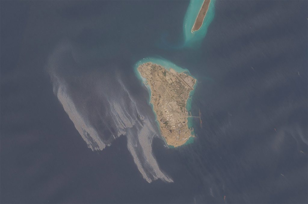 A satellite image shows an oil slick spreading off the coast of Kharg Island, a key oil export terminal for Iran.