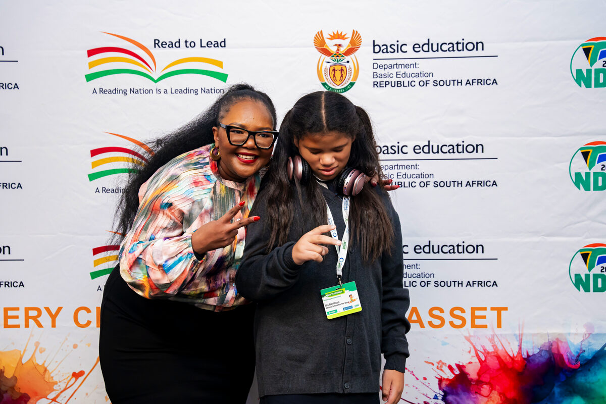 Minister of Basic Education Siviwe Gwarube and learner Ilia Davidson from Athlone School for the Blind.