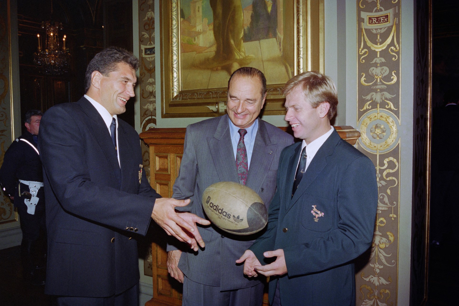 French rugby captain Marc Cecillon (L) hands over the ball to the Springboks captain Naas Botha in 1992