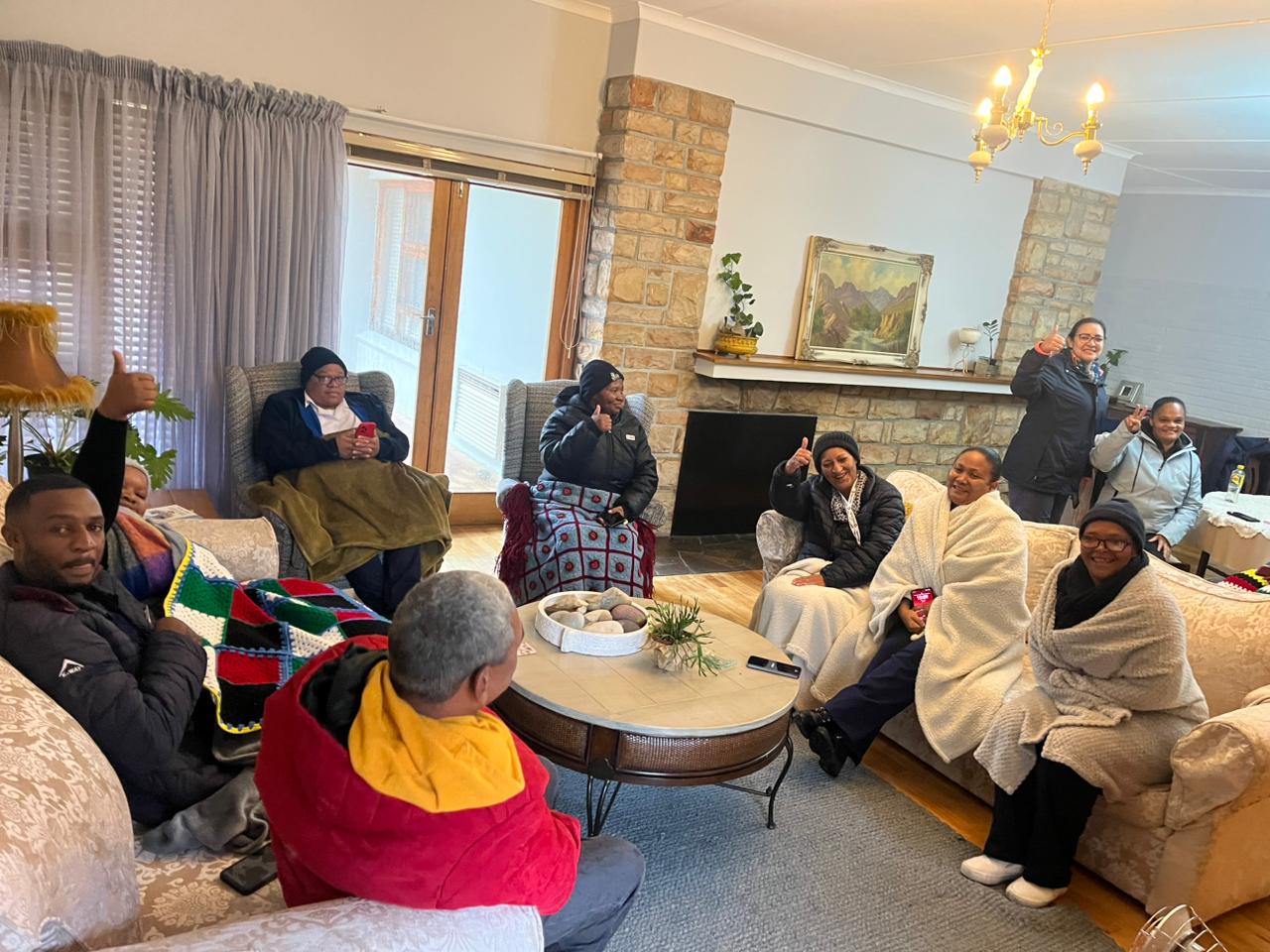 Staff from Op Die Berg clinic being kept safe and warm, and cared for by Reverend Albie Steenkamp and his wife, Ilse Steenkamp. Photo: Supplied