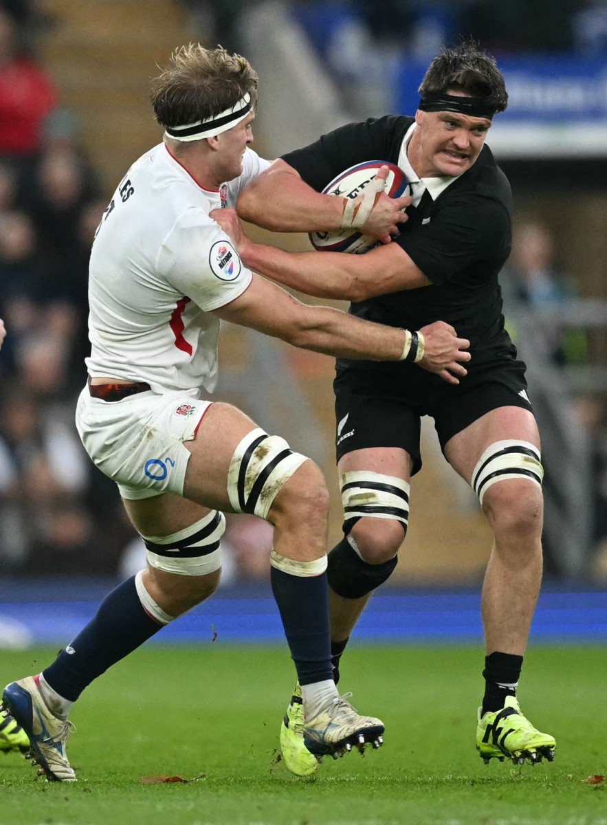 England's lock Alex Coles tackles New Zealand's lock Scott Barrett during the Autumn Nations Series international rugby union match between England and New Zealand at Allianz Stadium, Twickenham,