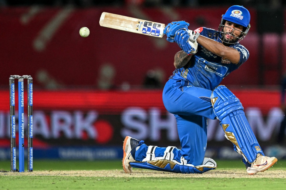 Mumbai Indians' Indian cricket player Tilak Varma plays a shot during the 2026 Indian Premier League (IPL) T20 match between Punjab Kings and Mumbai Indians