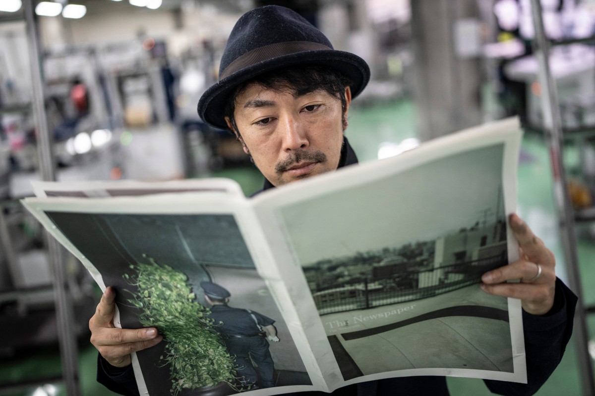 Kazuma Obara with his work "The Newspaper".