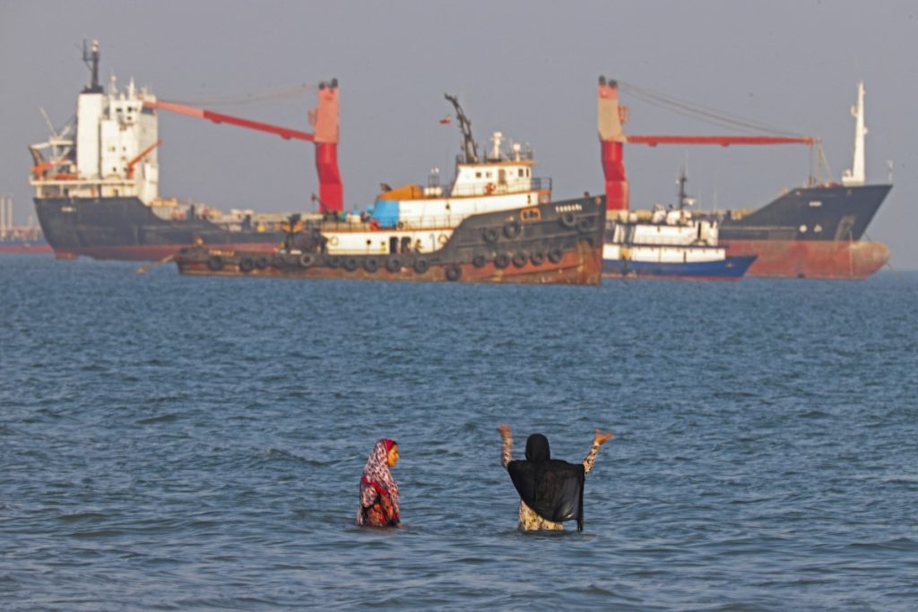 Iranians swim at Suru Beach in Bandar Abbas along the Strait of Hormuz.