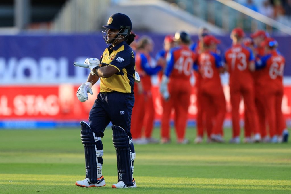 Sri Lanka's captain Chamari Athapaththu walks back to the pavilion after losing her wicket.