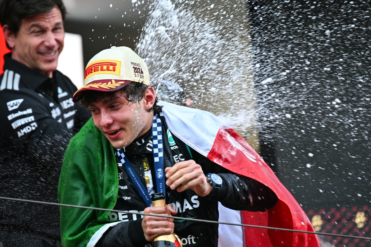 Mercedes' Italian driver Kimi Antonelli celebrates on the podium after competing in Monaco.