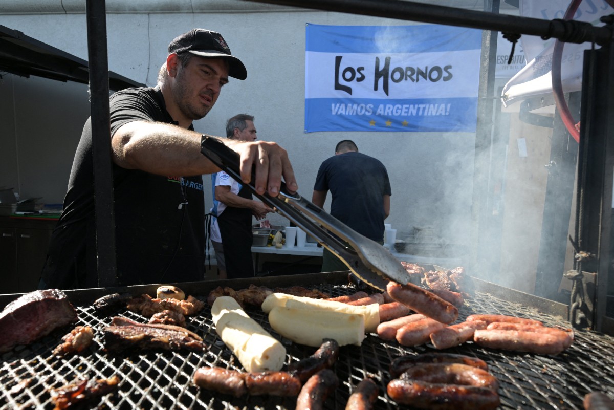 Dario Jerez Leavy owner and "parrillero" of "Los Hornos" prepares chorizos asados at his restaurant that caters Argentinian barbecue specialties, near Kansas City, Missouri.