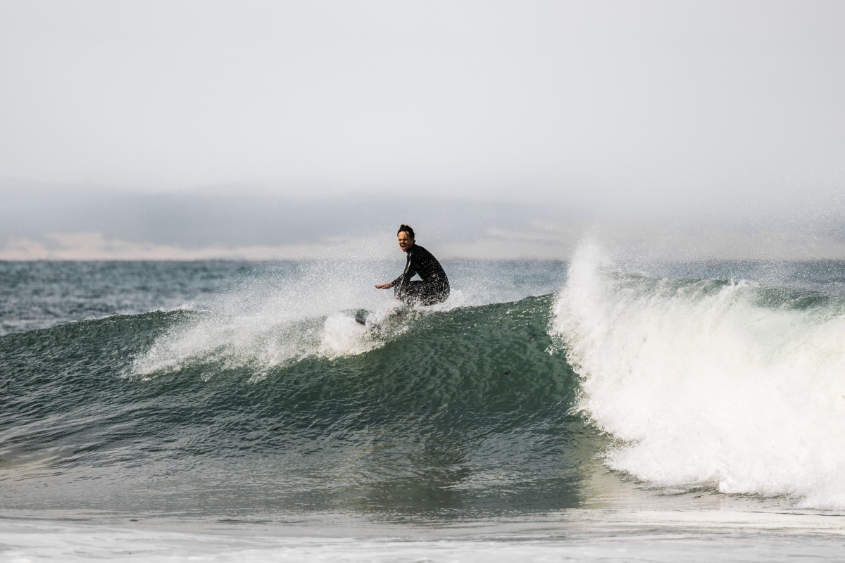A surfer rides a wave in Jeffreys Bay, on March 7, 2026. Known worldwide simply as "J-Bay", South Africa's surf capital is grappling with uncertainty after losing its place on the World Surf League circuit in 2026.