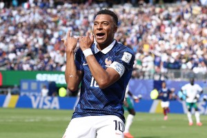 France begin World Cup campaign with victory as Mbappé breaks record