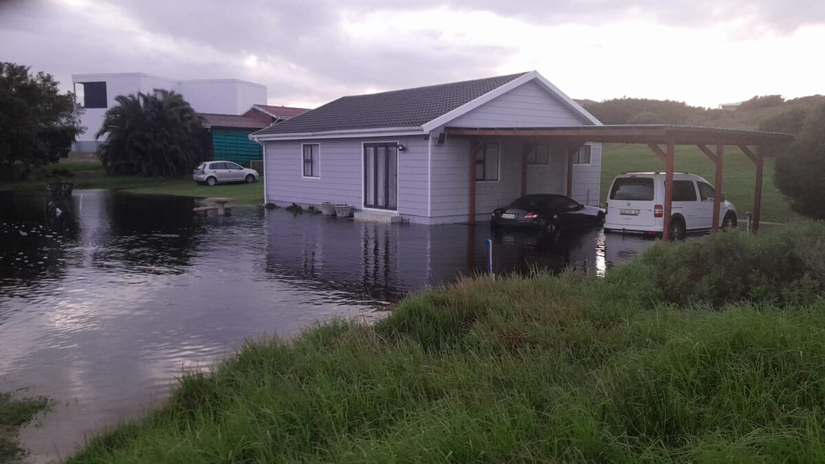 Flooded yard and road in Johan Muller Boulevard, Paradise Beach, following heavy June rainfall in the Kouga area.