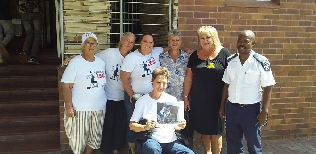 The team, WO Anje Tait (investigating officer), Charmaine Labuschagne (prosecutor) and Senior Inspector Ernest Khakau (investigating officer) with members of the public