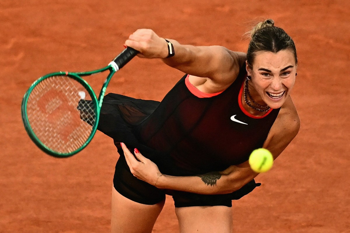 Aryna Sabalenka serves to Japan's Naomi Osaka during their women's singles match