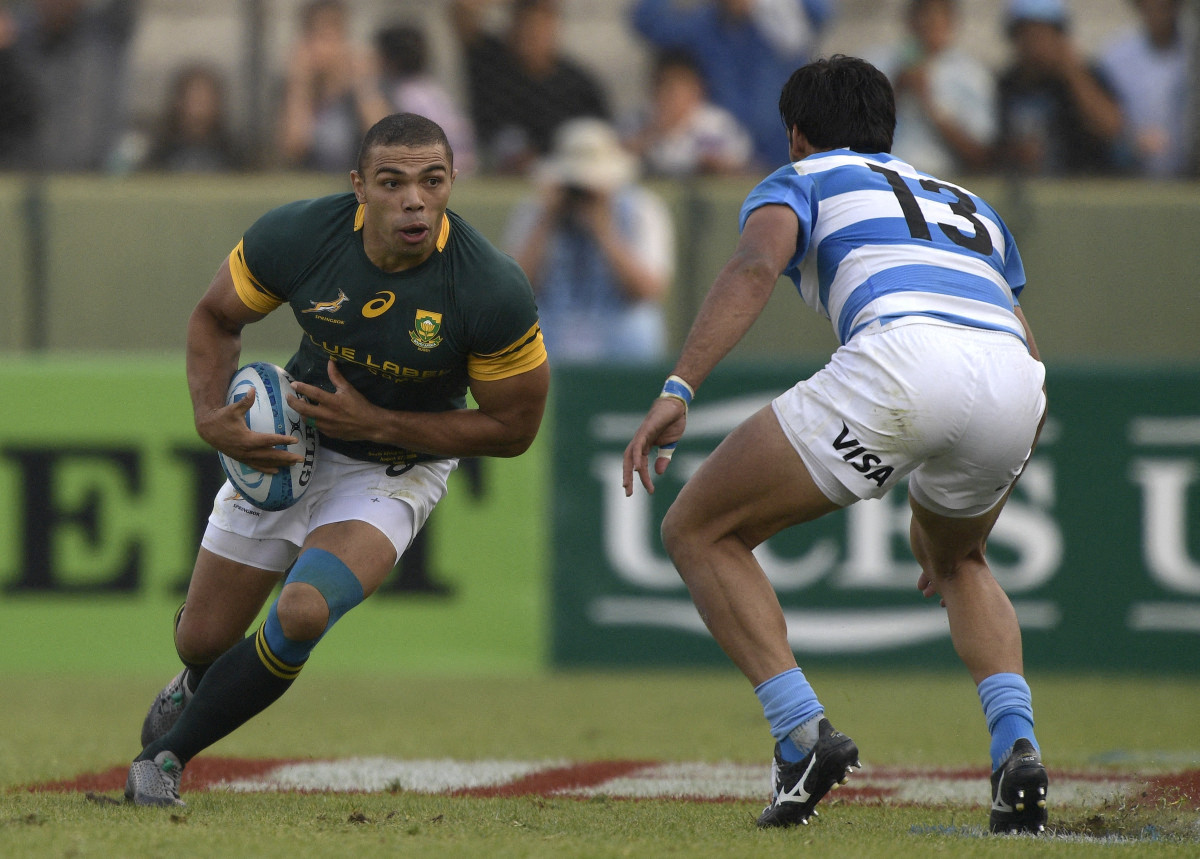 South Africa's wing Bryan Habana (L) challenge to Argentina's Los Pumas centre Matias Orlando during their Rugby Championship match at Padre Ernesto