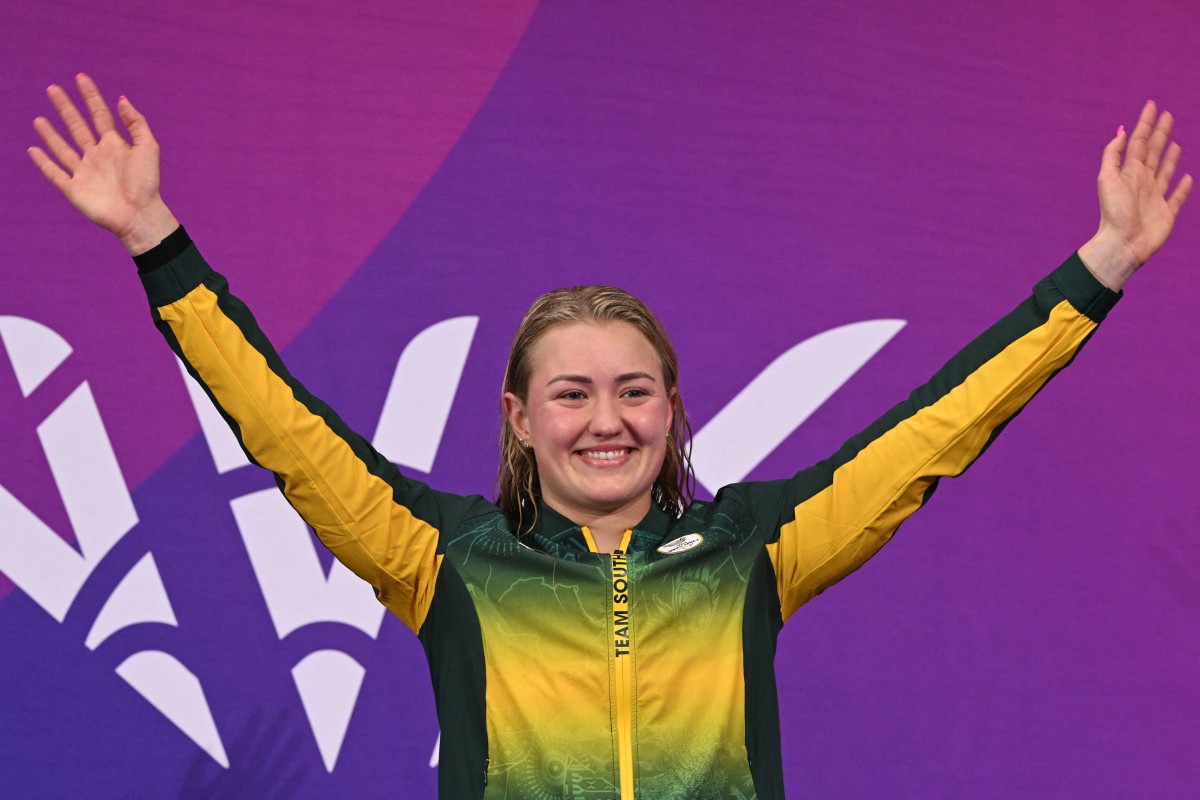 South Africa's Lara van Niekerk celebrates after winning gold in the Women's 50m Breaststroke of the Commonwealth.