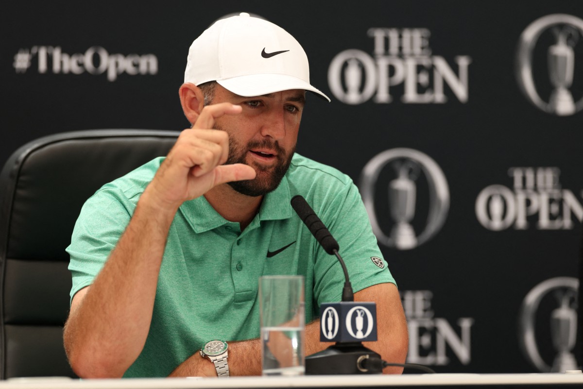 US golfer Scottie Scheffler gestures during a press conference held ahead of the 154th Open Golf championship at Royal Birkdale Golf Club