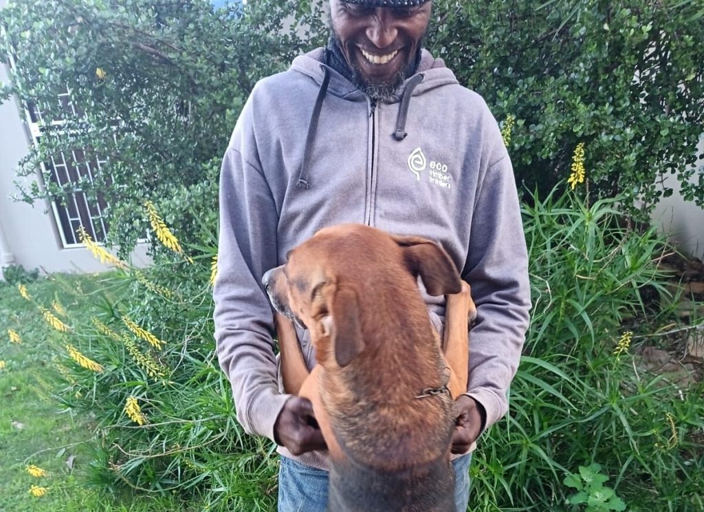 Fireman the dog with owner Stephen Singhini before their planned reunion in Malawi.