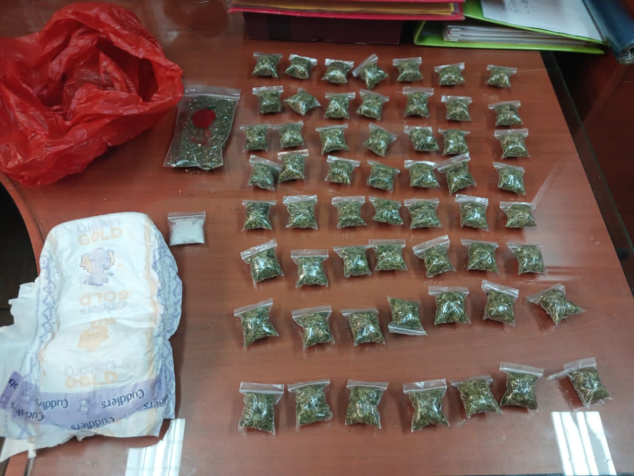 Two arrested after police find dagga concealed in diaper, courier parcel