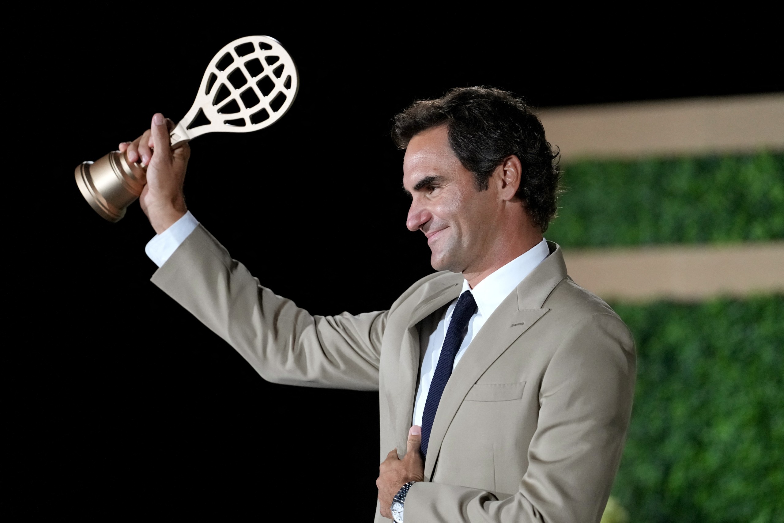 Inductee Roger Federer with his golden racquet following the International Tennis Hall of Fame 2026 induction ceremony on Saturday 29 August. Photo: Joe Buglewicz
