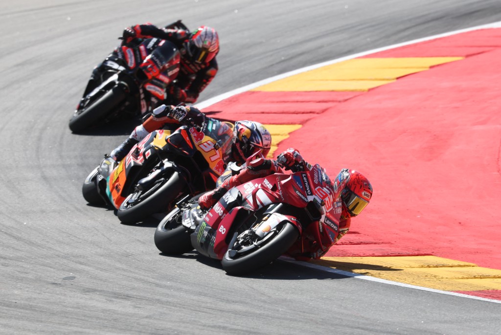 Marc Marquez rides ahead of Pedro Acosta and Marco Bezzecchi. Photo: Pierre-Philippe Marcou/AFP