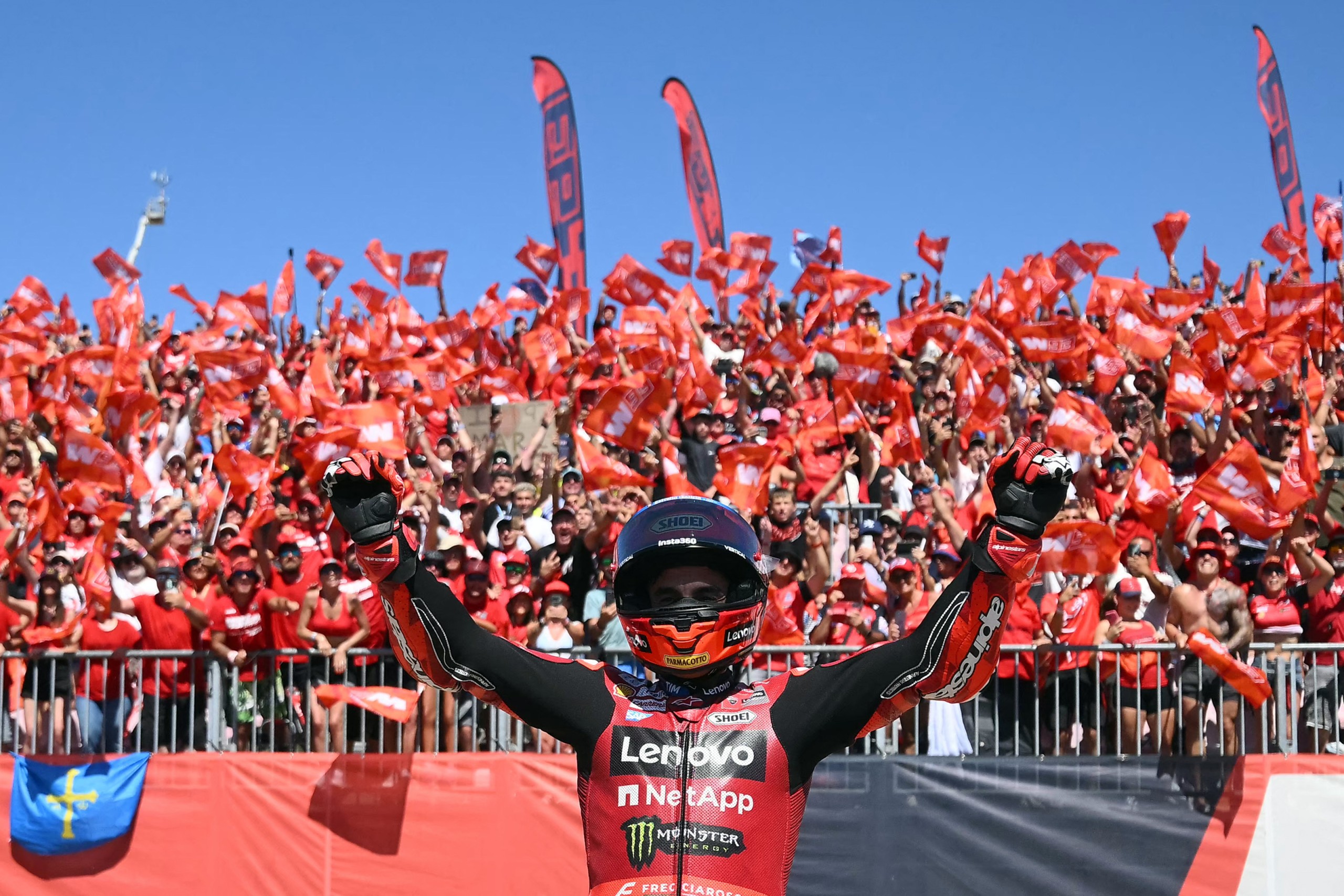 Marc Marquez celebrates his victory with fans after the MotoGP. Photo: Jose Jordan/AFP