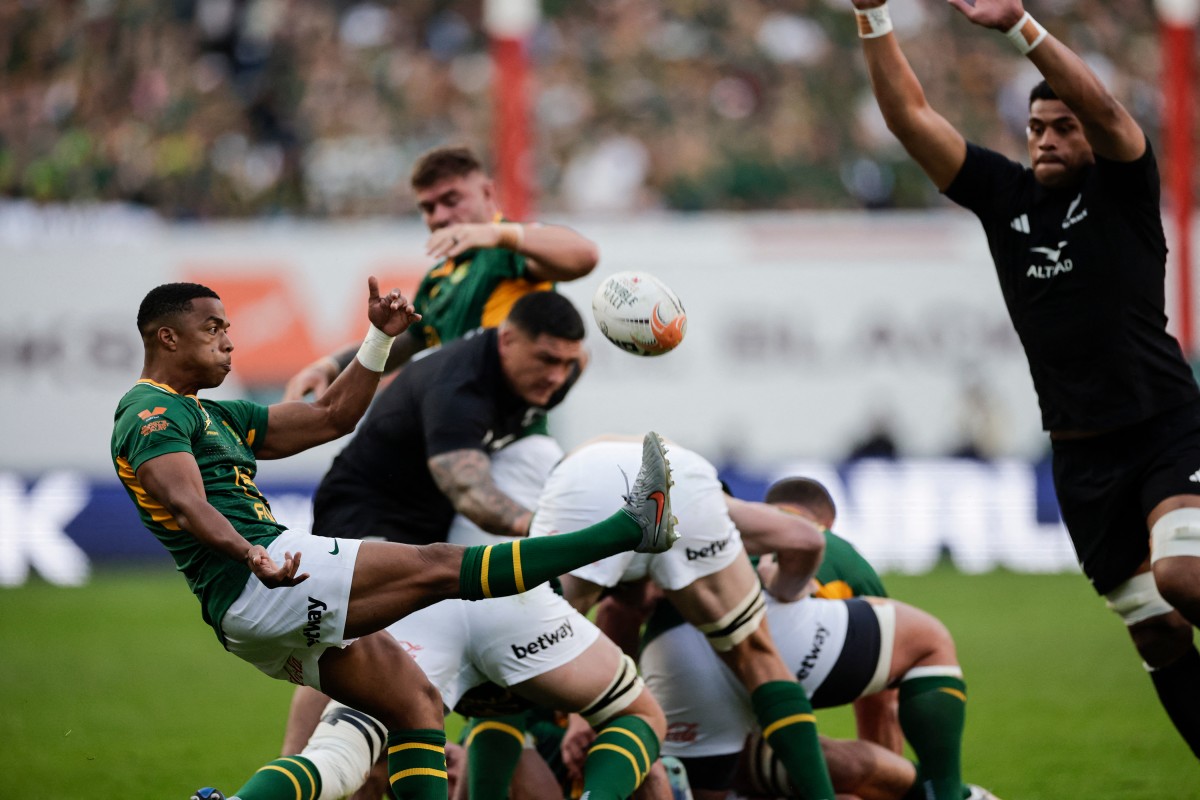 South Africa's scrum-half Grant Williams kicks the ball during the Rugby's Greatest Rivalry match.