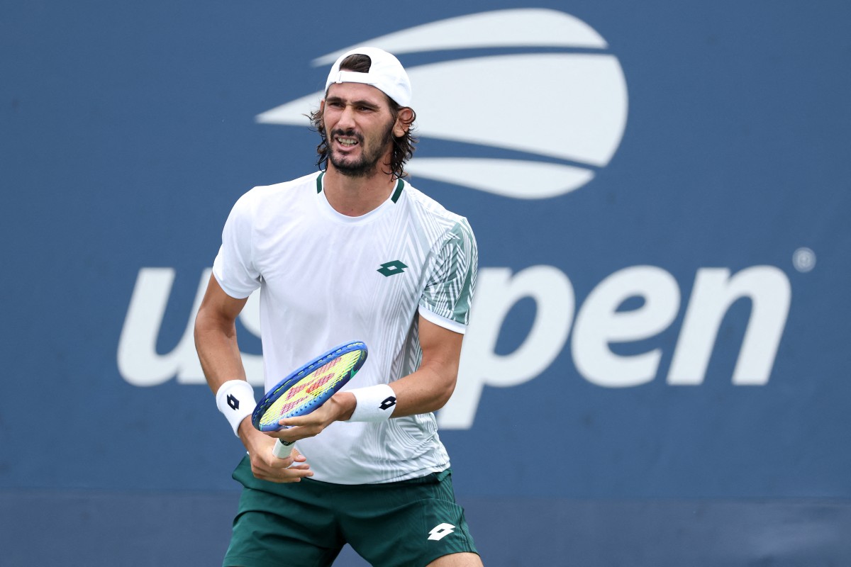 Lloyd Harris of South Africa returns against Jack Kennedy of the United States during their Men's Singles First Round match of the 2026 US Open.