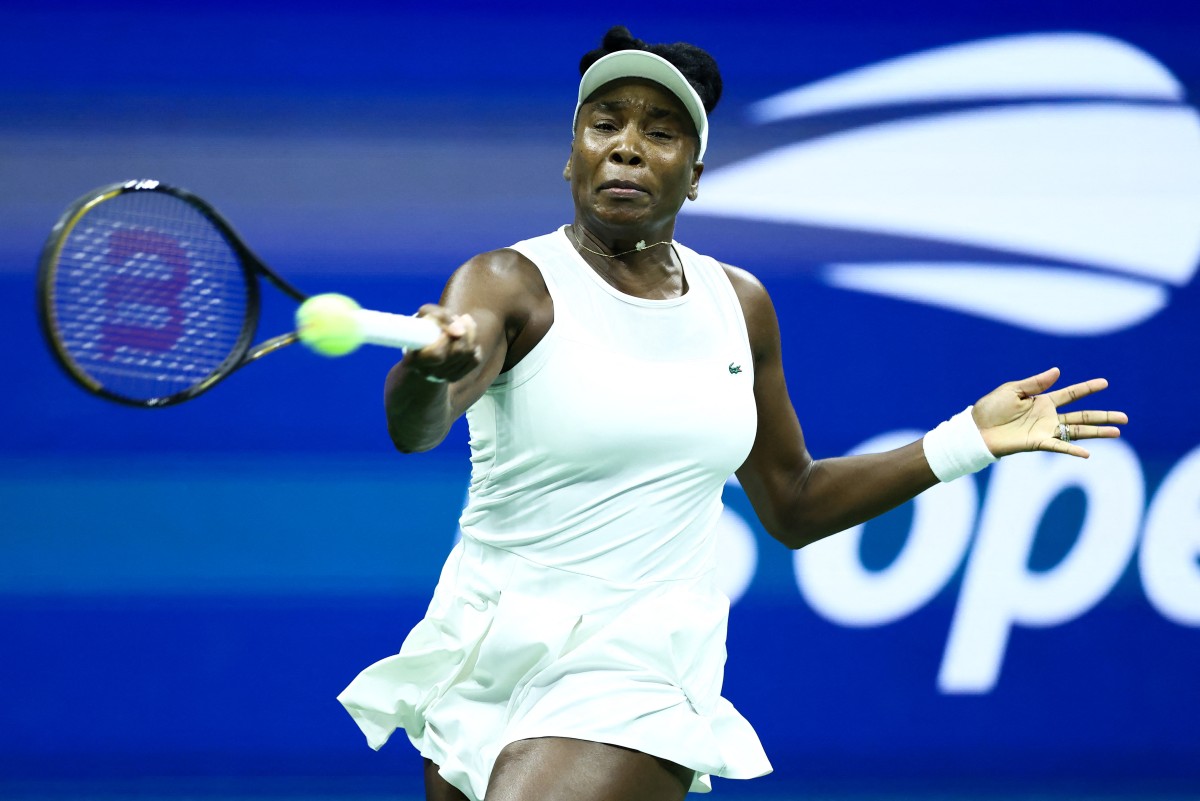 Venus Williams hits a forehand against USA's Sofia Kenin during the women's singles first round tennis match on day one of the US Open