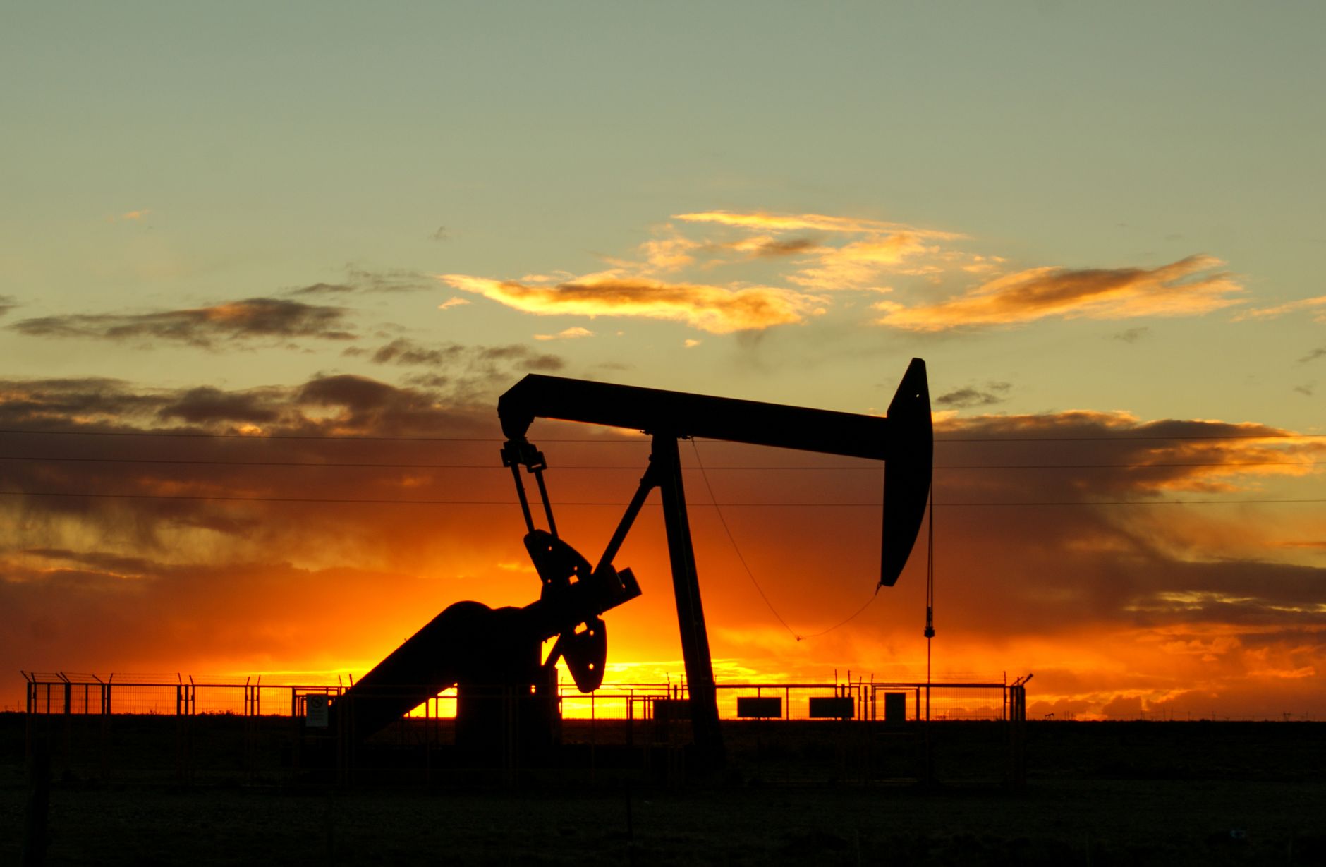 Oil well at sunset