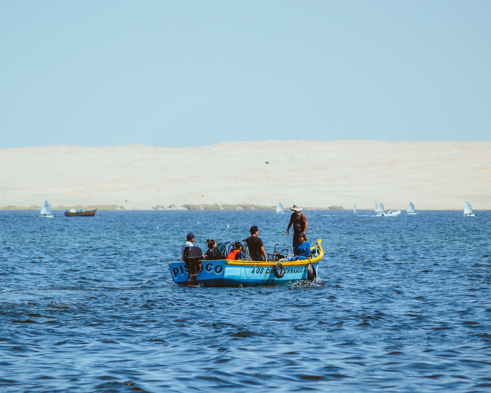 men on a boat in sunlight