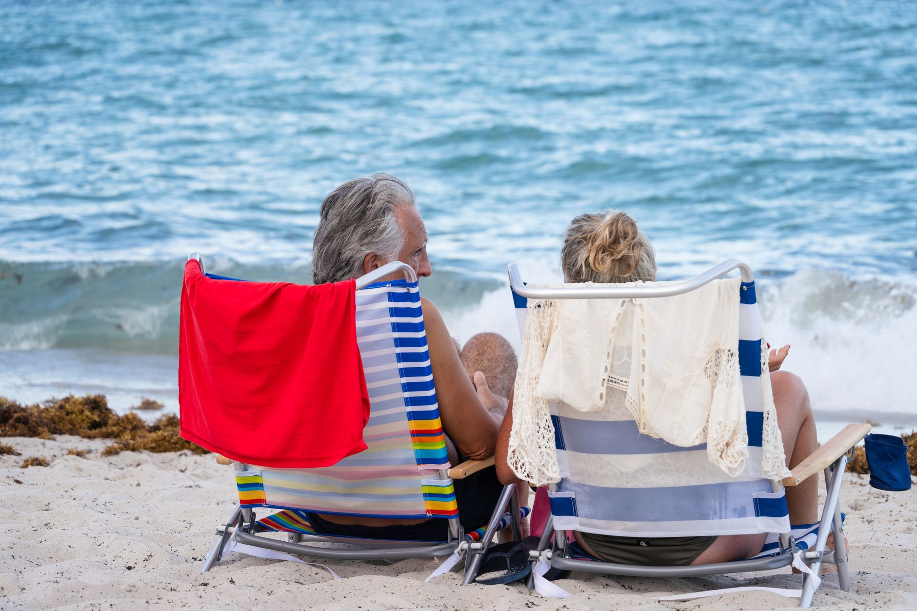 relaxed senior couple enjoying miami beach