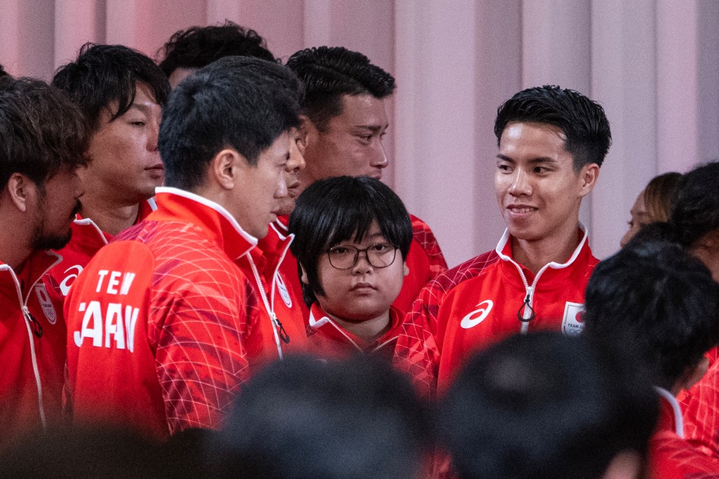 Yuki Kurihara (11) waits for a team Japan photo. Photo: Andrew Caballero-Reynolds/AFP