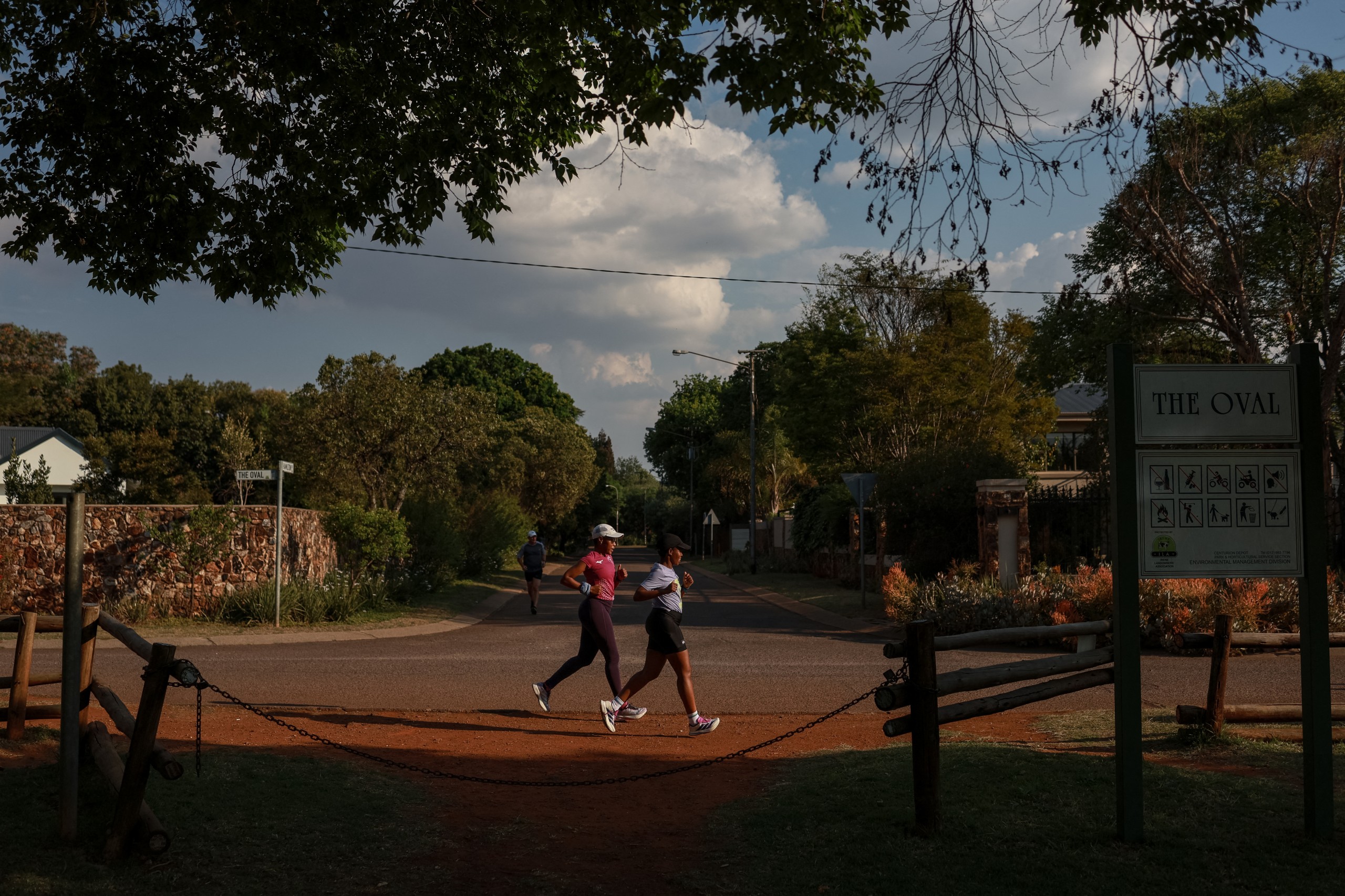 Nancy Masha (right) and Babalwa Melitafa run inside a gated community in Pretoria as a precaution after nine women were found murdered in Johannesburg's East Rand. Photo: Phill Magakoe