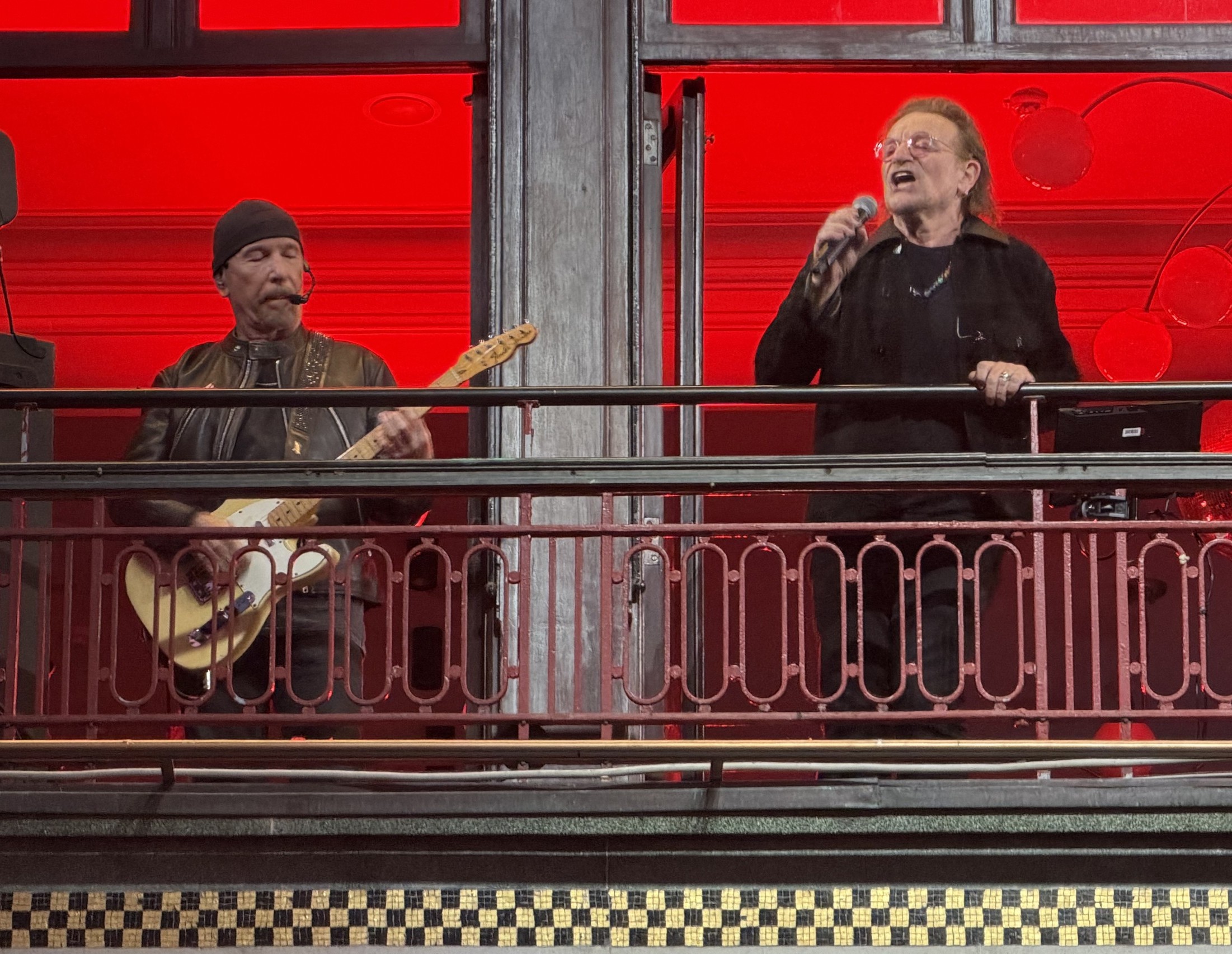 The Edge and Bono of Irish rock band U2 perform on the balcony of Bewley's Oriental Cafe in central Dublin on 25 September, as they mark the 50th anniversary of their formation in 1976. Photo: Peter Murphy/AFP