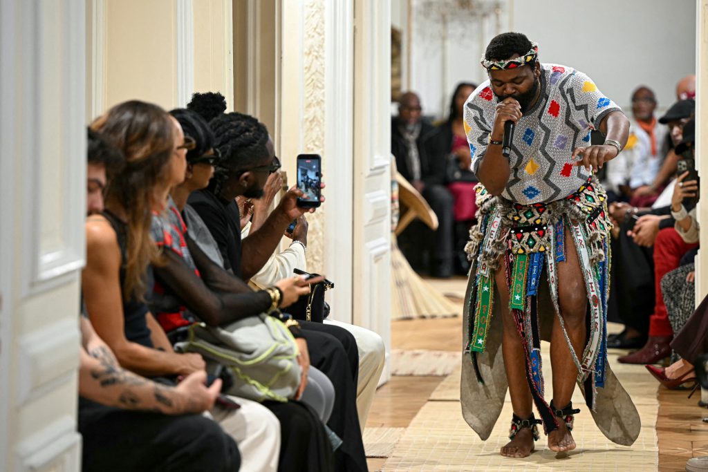 A singer performs during the presentation of the MaXhosa Africa in Paris.