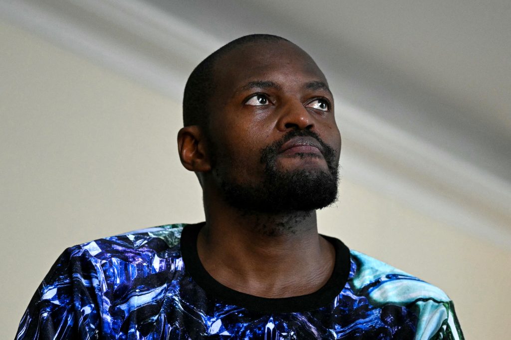South African fashion designer Laduma Ngxokolo speaks at the Paris Fashion Show.