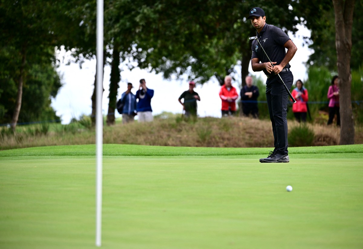Aaron Rai watches his putt on the 5th green during the first round of the BMW PGA Championship at Wentworth Golf Club
