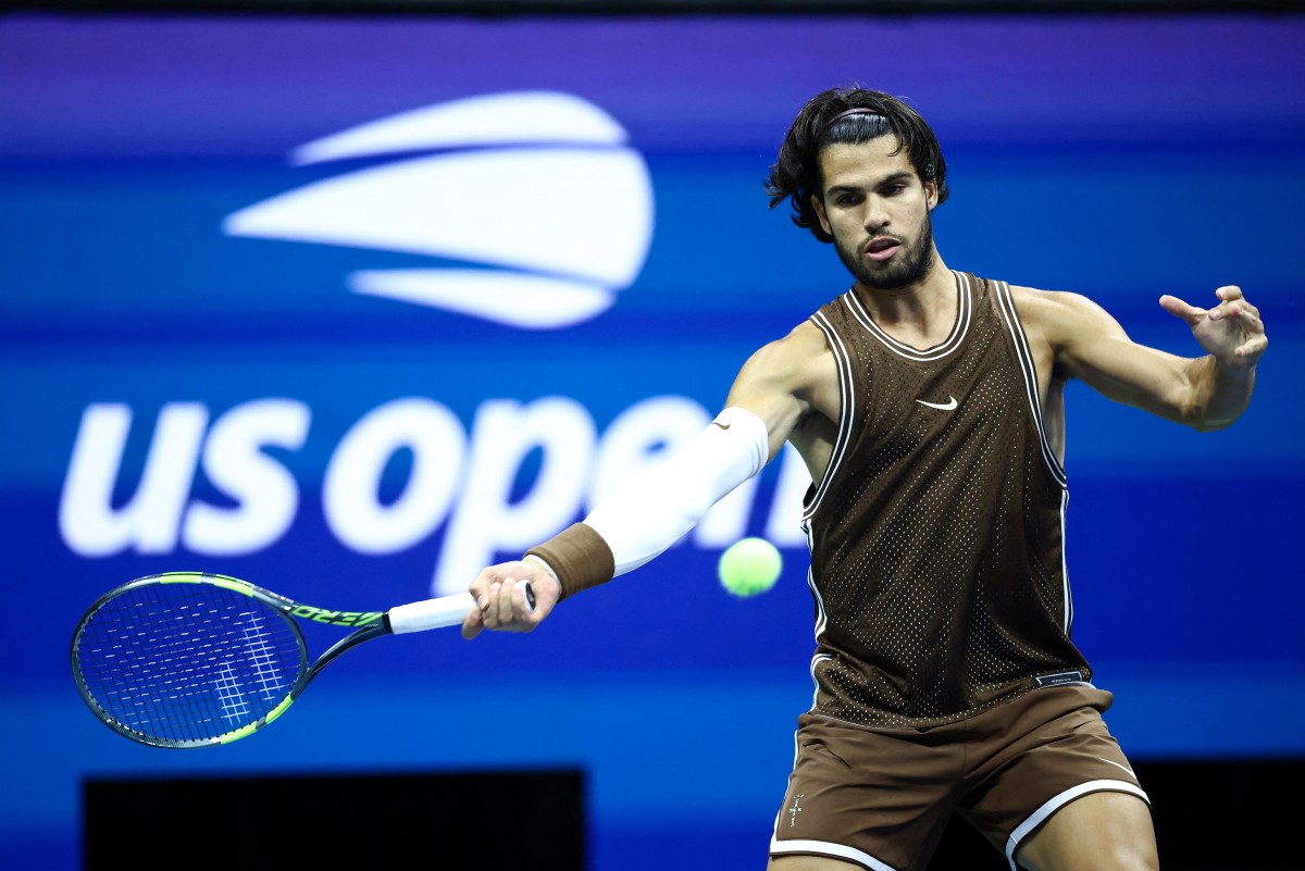 Spain's Carlos Alcaraz hits a forehand return against Portugal's Jaime Faria during the men's singles second round tennis match on day four of the US Open