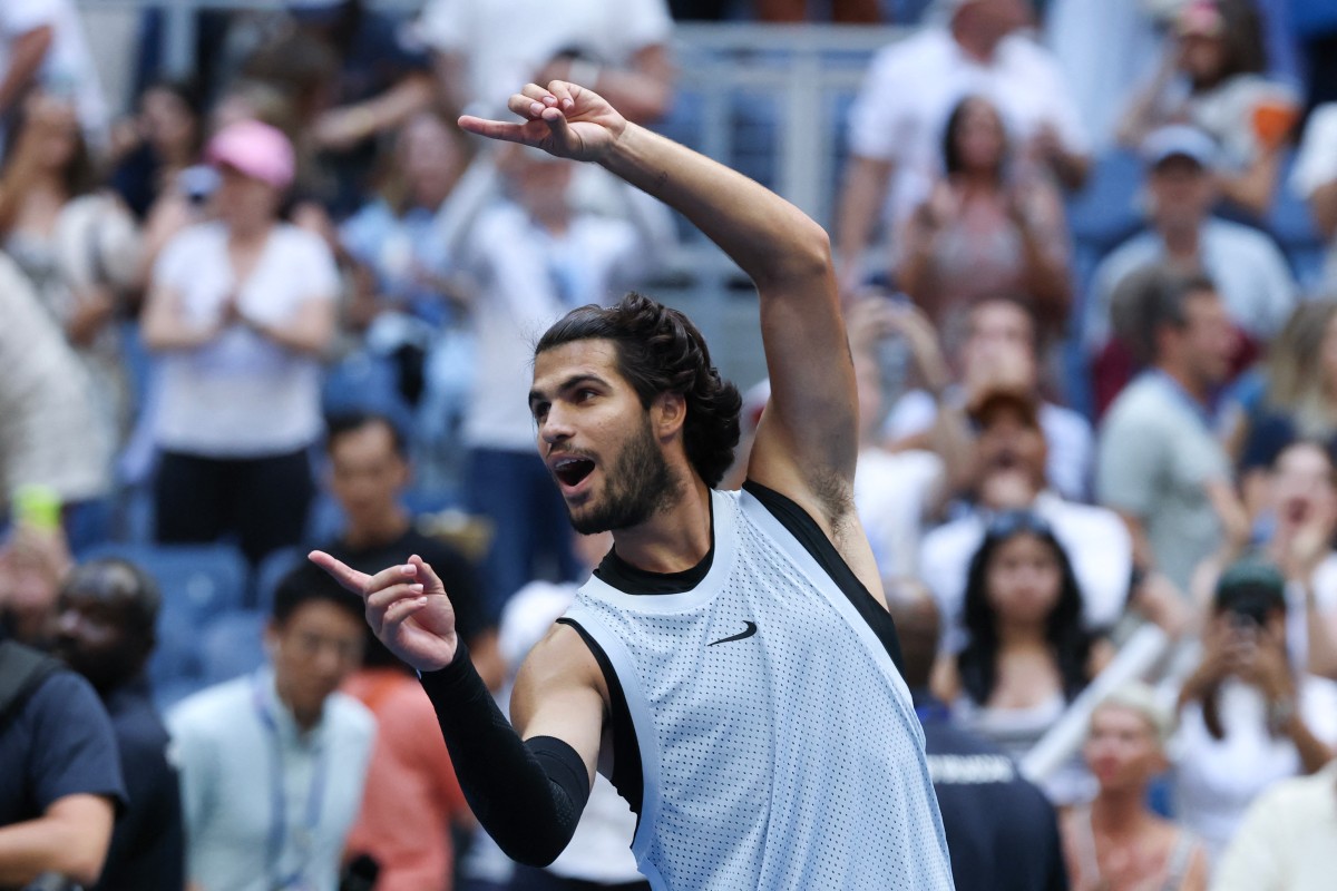 Carlos Alcaraz celebrates defeating USA's Tommy Paul in their men's singles round of 16 US Open match.