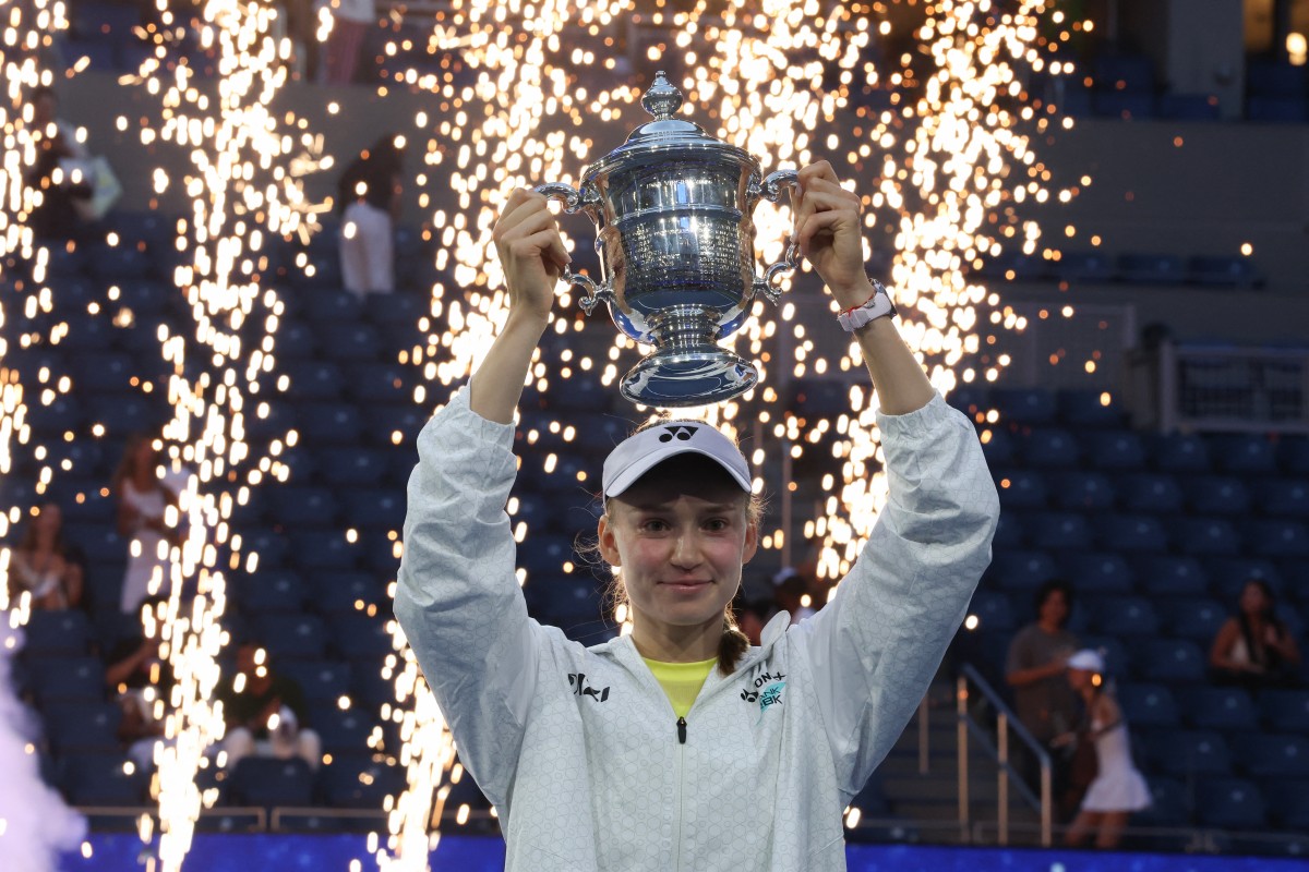 Kazakhstan's Elena Rybakina holds up the winner's trophy after winning the women's singles US open finals.