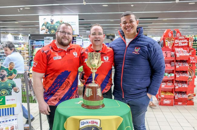 Roses United chairman Herman Bailey (right) poses with the iconic Gold Cup trophy. Photo: Supermarketing.co.za.