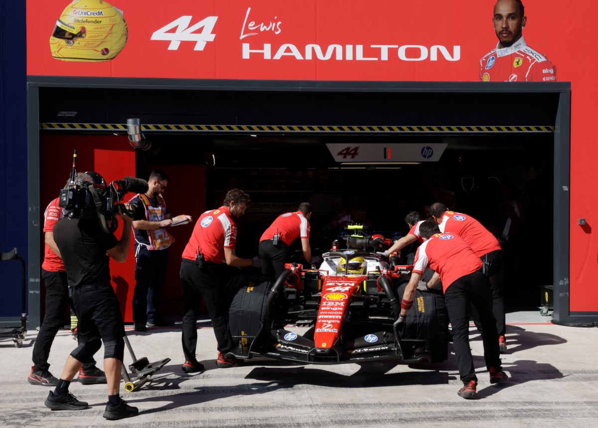 Team Ferrari's Lewis Hamilton is pictured in the pit lane at the start of the qualifying session at the Madring circuit